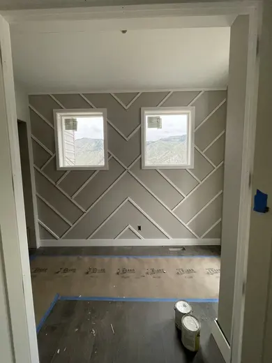 Diagonal applied wall trim between two tall windows, view 2.