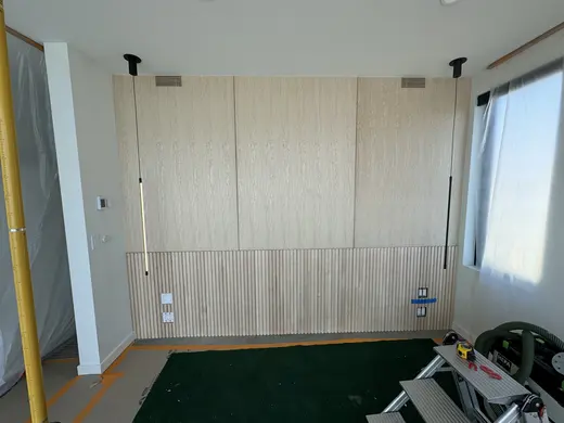 Flush wood wall panels, lower fluting and an integrated slatted vent, view 2.