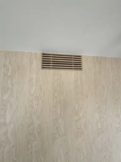 Flush wood wall panels, lower fluting and an integrated slatted vent, view 3.