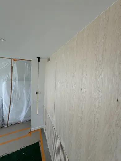 Flush wood wall panels, lower fluting and an integrated slatted vent, view 4.
