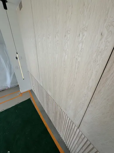 Flush wood wall panels, lower fluting and an integrated slatted vent, view 5.
