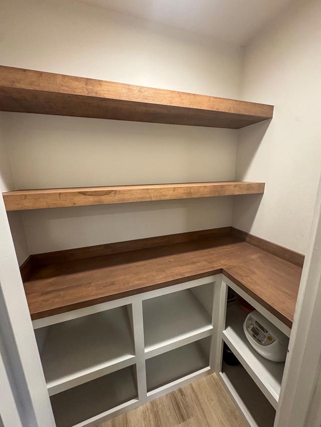 Custom floating wood shelves and matching pantry countertop