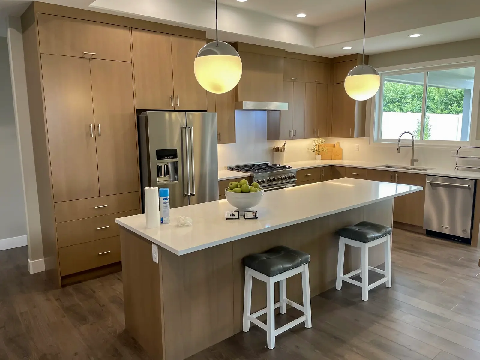 Finished natural-wood kitchen cabinetry and island